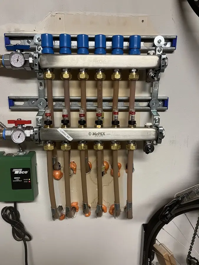 Plumber performing Gas Line Installation at a residential property in Loveland